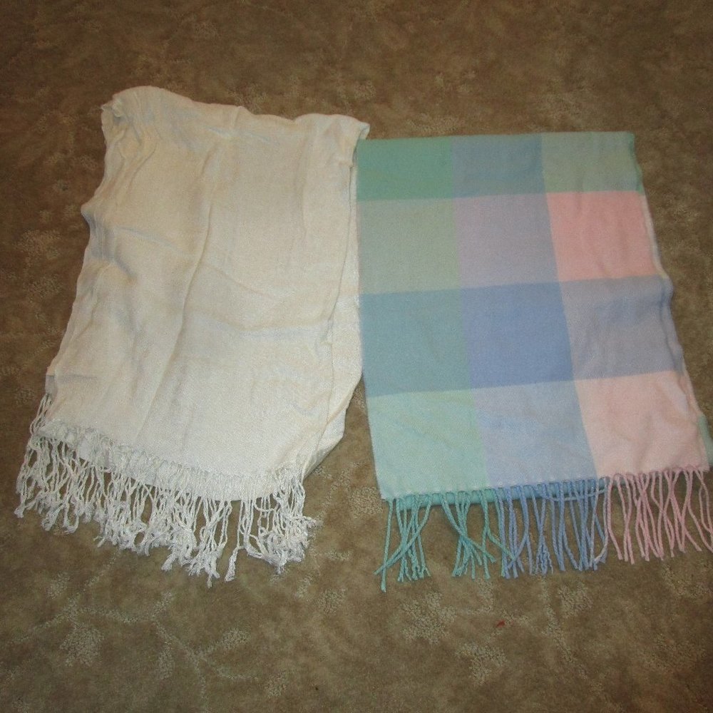 Two light colored scarfs